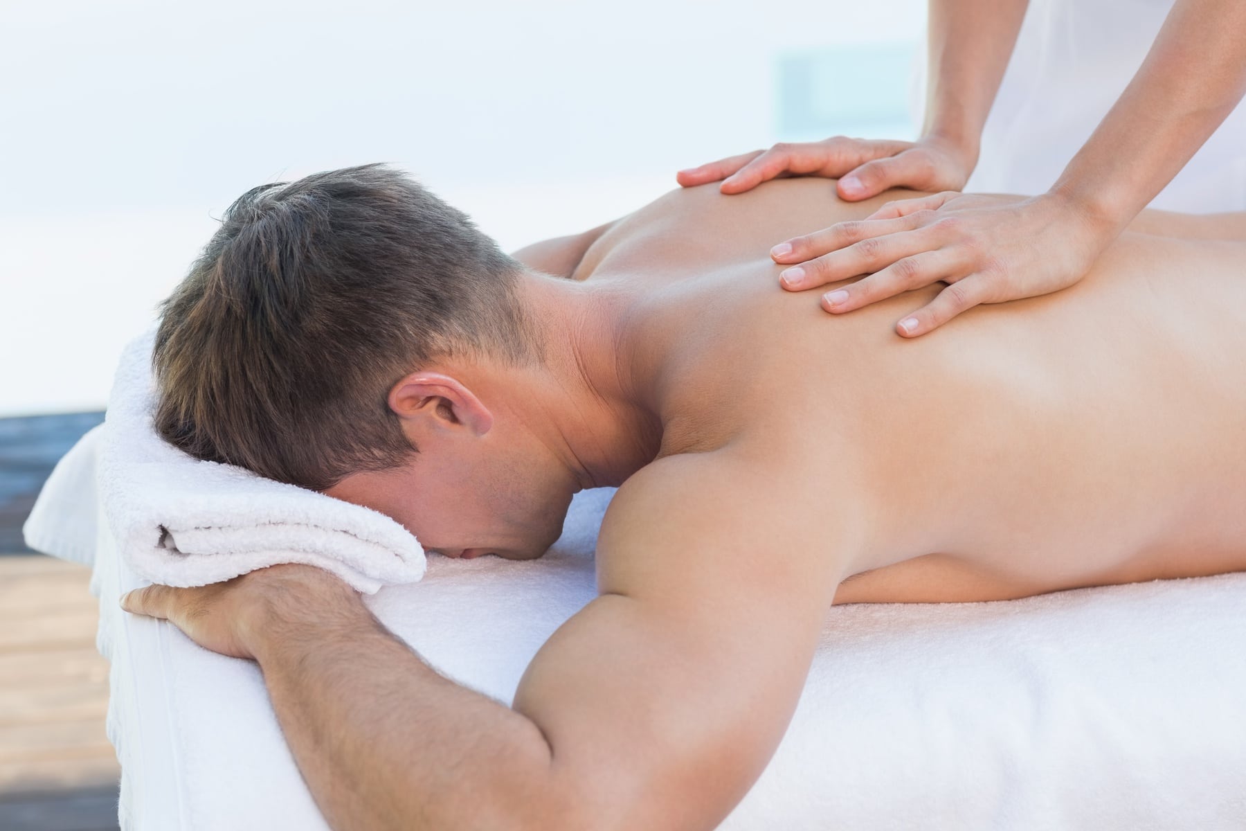 man receiving a back massage