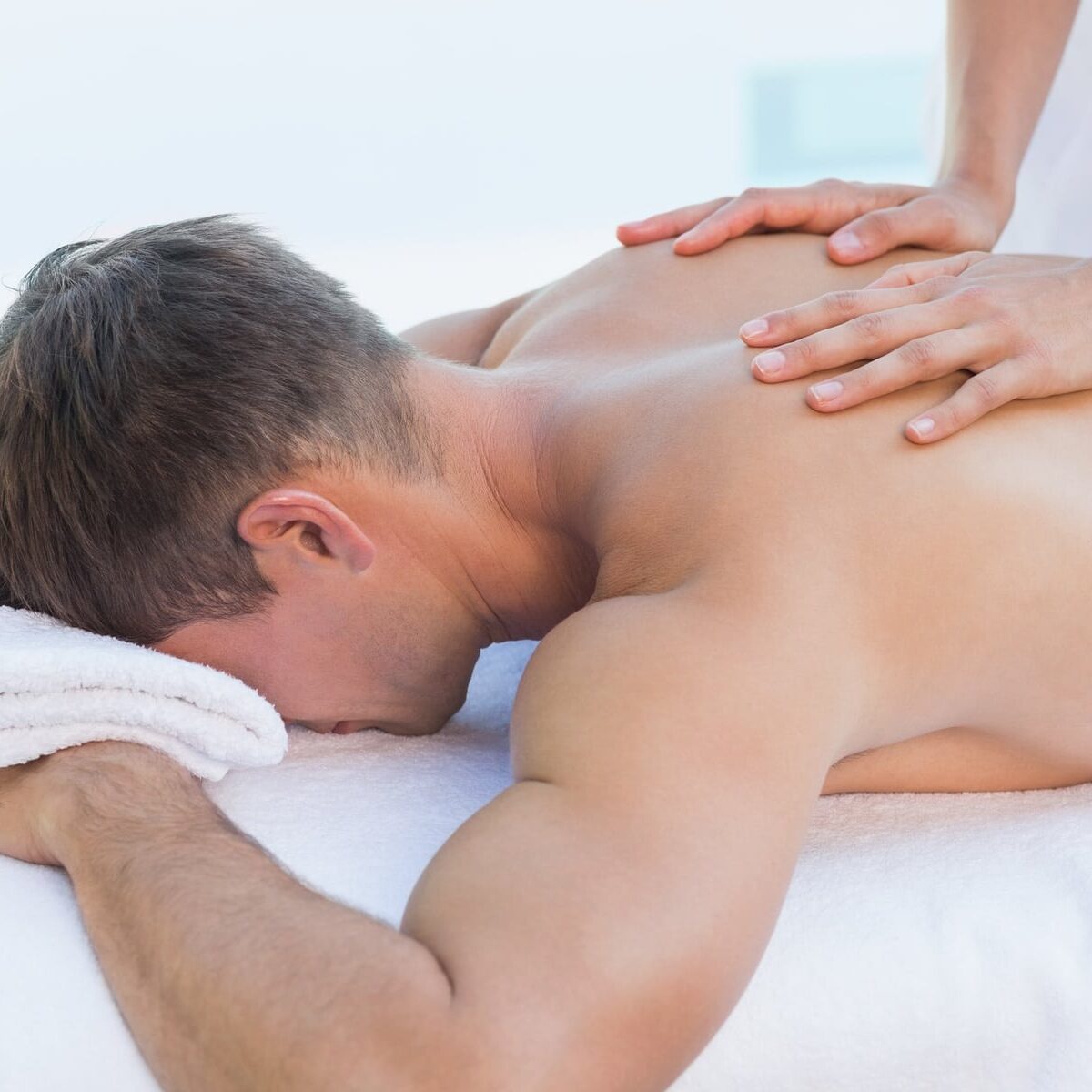 man receiving a back massage